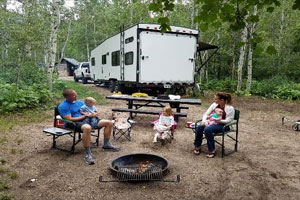 Family in front of RV
